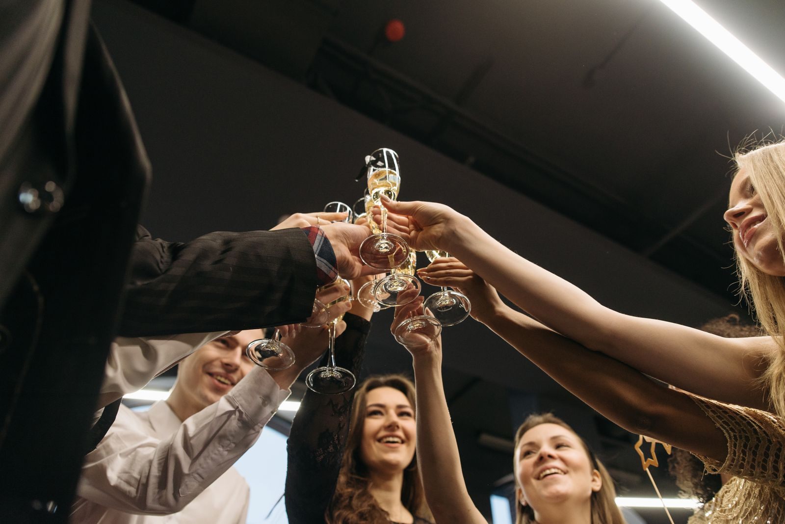 Friends raising champagne glasses together, the shared bond behind affinity group travel