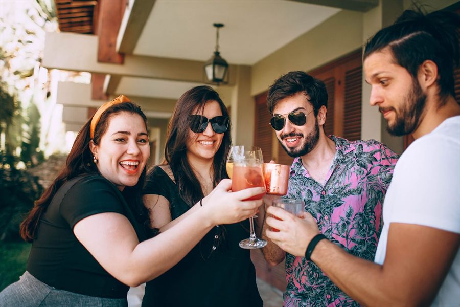 Friends raising glasses together at a celebration